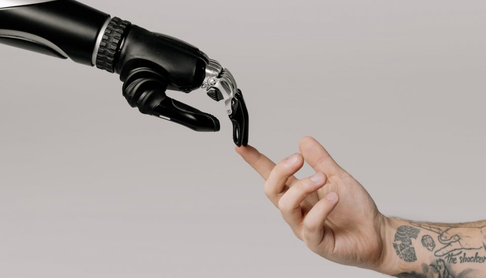 bionic hand and human hand finger pointing